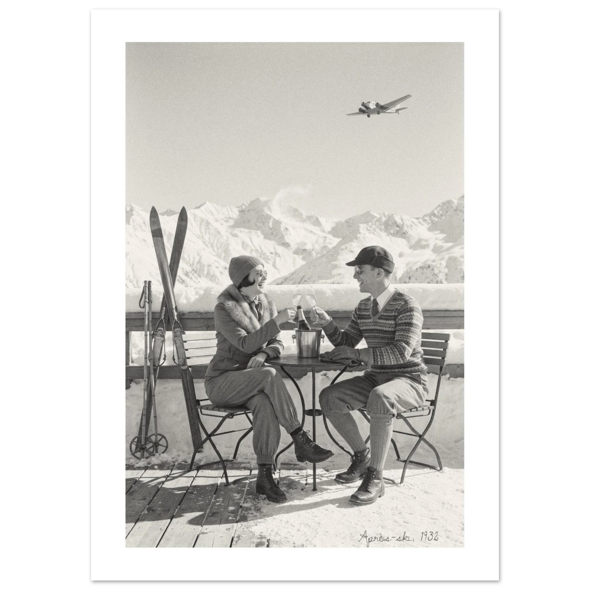Couple toasting with champagne on a snowy alpine terrace, 1932 style black and white photo print