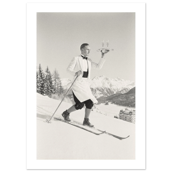 Ski waiter in white jacket skiing downhill with a tray of champagne, 1930s style black and white photo print